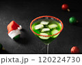 Xmas Grinch Punch in glass decorated sugar rim on black table make of cool lime sherbet. Tasty drink for Christmas holiday. Rim your festive beverages in red sugar. Close up. 120224730