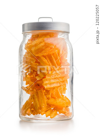 Crispy potato chips in jar isolated on white background. Crispy potato chips in jar isolated on white background. 120225057