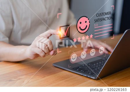 Customer engage in a satisfaction survey, using an online application to rate their service experiences. This evaluation helps determine the quality of service and business reputation rating. 120226163