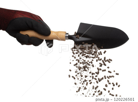 Fertilizer Organic natural fly fall in shovel glove, tube compost fertilizer for planting float in air. Organic fertilizer throw in mid air. White background isolated high speed freeze motion 120226501