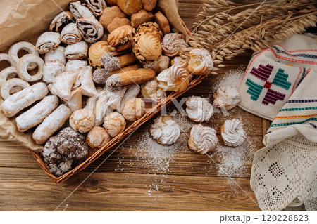 Traditional Ukrainian cookies in basket with embroidered cloth, rustic and cultural dessert display 120228823