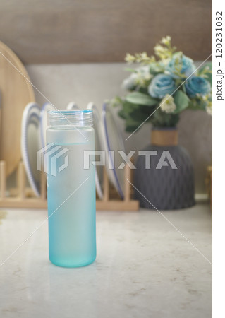 A Refreshing Bottle of Water Set Against a Beautiful and Decorative Background Scene 120231032