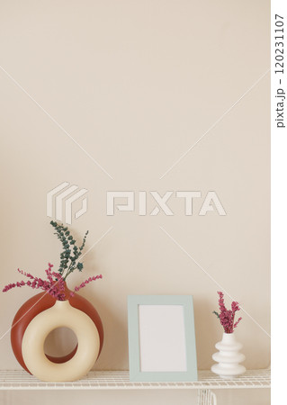 Explore Stylish, Minimalist Decor Featuring Vases and a Beautiful Picture Frame Display 120231107
