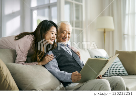 asian elderly father and adult daughter having a good time 120232251