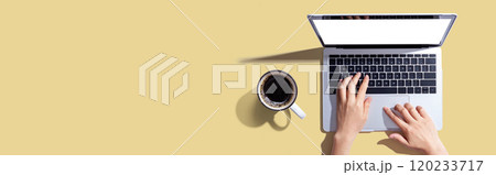 Person using a laptop computer Person using a laptop computer 120233717