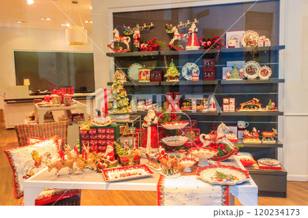 Christmas crockery and flatware on display in a home decoration shop 120234173