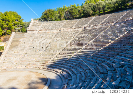 Ancient Theatre of Epidaurus is theatre in Greek city of Epidaurus, located on southeast end of sanctuary dedicated to the ancient Greek God of medicine, Asclepius in Peloponnese, Greece 120234222