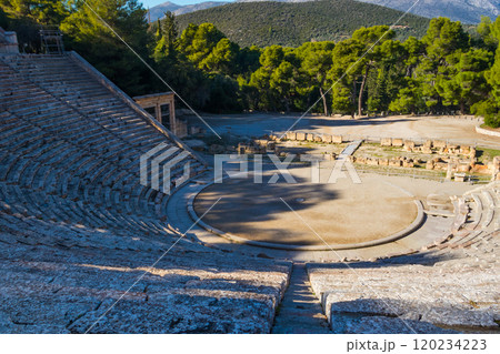 Ancient Theatre of Epidaurus is theatre in Greek city of Epidaurus, located on southeast end of sanctuary dedicated to the ancient Greek God of medicine, Asclepius in Peloponnese, Greece 120234223