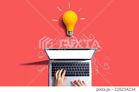 Idea light bulb flying to the sky like a rocket from a laptop computer 120234234