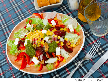 Salad with feta cheese vegetables and pesto 120235246