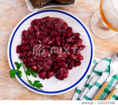 Appetizing red beans with green parsley on dining table Appetizing red beans with green parsley on dining table 120235588