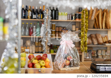 Gift box of food on counter in grocery store Gift box of food on counter in grocery store 120235694