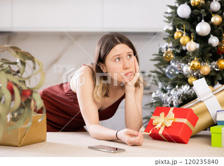 Portrait of a frustrated young woman at home 120235840