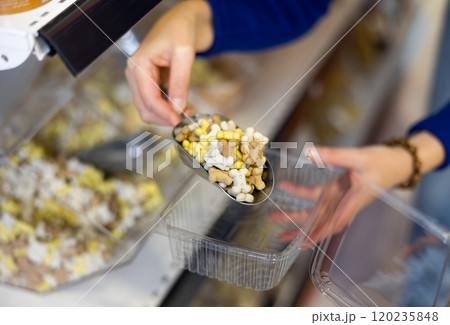 Assorted dry dog treats displayed in pet shop 120235848