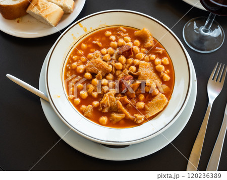 Traditional Spanish dish with chickpeas and meat 120236389