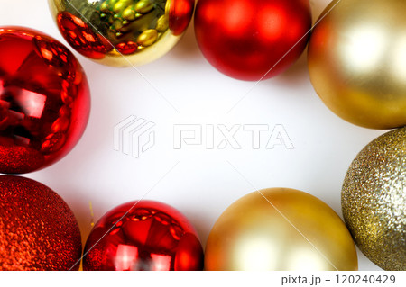 Red and gold Christmas balls lie around on a white background, with space for text in the center of the photo. The concept of Christmas, New Year and Holiday. High quality photo Red and gold Christmas balls lie around on a white background, with space for text in the center of the photo. The concept of Christmas, New Year and Holiday. High quality photo 120240429