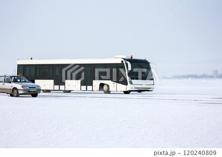 Airport bus and car on the winter apron 120240809