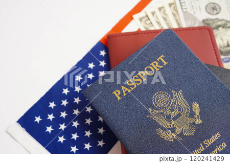 US passport issued to citizen and national of the United States of America to travel in most countries outside with USA flag and dollar money. US passport issued to citizen and national of the United States of America to travel in most countries outside with USA flag and dollar money. 120241429
