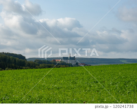 Neresheim, Germany - September 30th 2023: The famous monastery surrounded by hills and forests 120241738