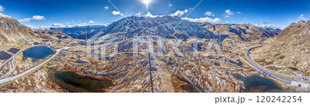 Drone panorama of Gotthard Pass in Switzerland with surrounding mountains and wind turbines 120242254