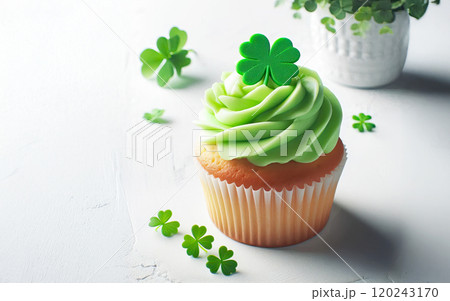 Yummy green cupcake on white background, St. Patric's Day 120243170