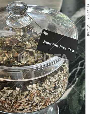 Closeup glass bowl of jasmine rice tea leaf Closeup glass bowl of jasmine rice tea leaf 120243213