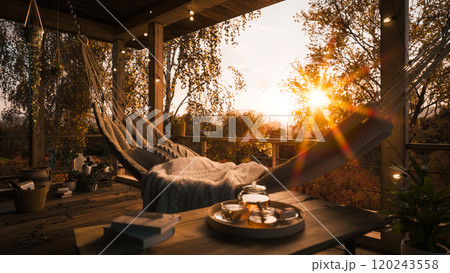 Golden autumn in a country house. Beautiful terrace in a private house. Golden autumn in a country house. Autumn sunset on the terrace. Hammock on the terrace Golden autumn in a country house. Beautiful terrace in a private house. Golden autumn in a country house. Autumn sunset on the terrace. Hammock on the terrace 120243558