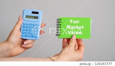 Fair Market Value concept. Price an asset would sell for on the open market when certain conditions are met. Business and finance. Calculator and notebook in hands Fair Market Value concept. Price an asset would sell for on the open market when certain conditions are met. Business and finance. Calculator and notebook in hands 120243777