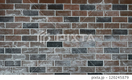 wall of black and brown bricks with a touch of white paint or lime as a textured contrasting background, graphic resource with a geometric pattern in a dark style 120245879
