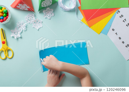 Advent calendar made of colored paper. Step-by-step instructions for making Christmas crafts. Diy for children. flat lay Advent calendar made of colored paper. Step-by-step instructions for making Christmas crafts. Diy for children. flat lay 120246096
