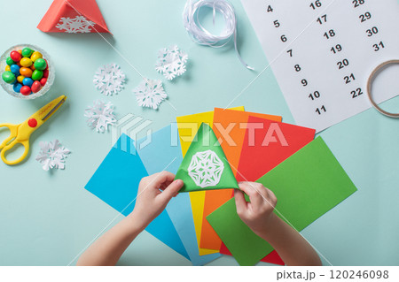 Advent calendar made of colored paper. Step-by-step instructions for making Christmas crafts. Diy for children. flat lay Advent calendar made of colored paper. Step-by-step instructions for making Christmas crafts. Diy for children. flat lay 120246098