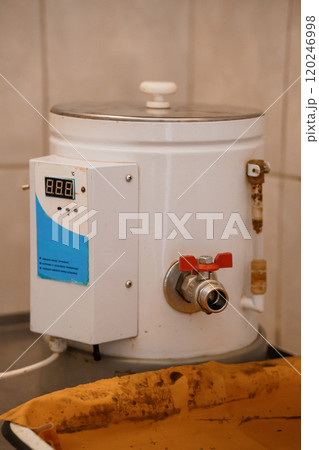 Industrial Water Heater with Digital Display in a Kitchen Environment 120246998