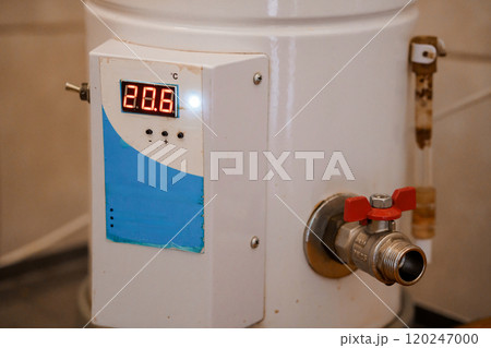 Digital Temperature Control on a White Water Heater with Red Valve 120247000