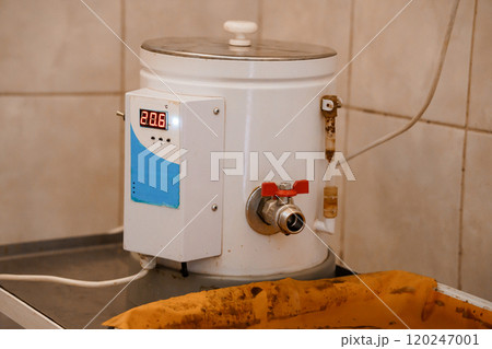 Electric Water Heater with Digital Temperature Display in a Kitchen Setting Electric Water Heater with Digital Temperature Display in a Kitchen Setting 120247001