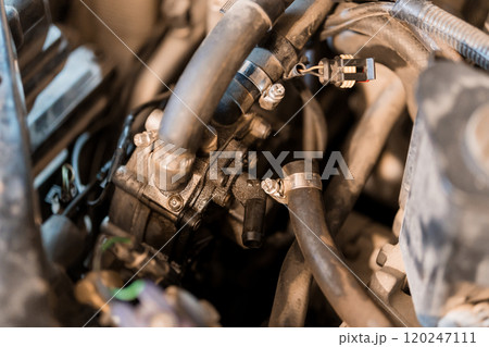 A Close-Up View of an Automobile Engine Component with Fluid Hoses A Close-Up View of an Automobile Engine Component with Fluid Hoses 120247111
