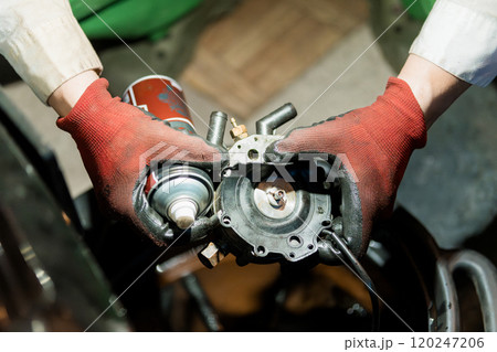 Detailed Inspection and Maintenance of Mechanical Component by Technician in Protective Gloves 120247206