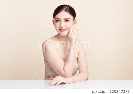 Beautiful young asian woman with clean fresh skin on beige background, Face care, Facial treatment, Cosmetology, beauty and spa, Asian women portrait. Beautiful young asian woman with clean fresh skin on beige background, Face care, Facial treatment, Cosmetology, beauty and spa, Asian women portrait. 120247878