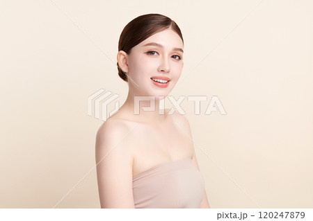 Beautiful young asian woman with clean fresh skin on beige background, Face care, Facial treatment, Cosmetology, beauty and spa, Asian women portrait. 120247879