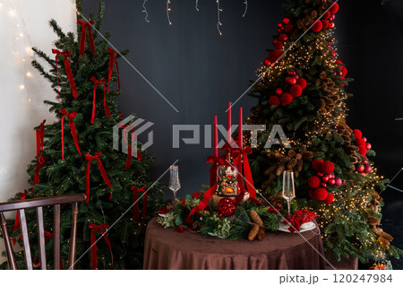 Festive Holiday Decor with Elegant Christmas Trees and Dinner Setting Festive Holiday Decor with Elegant Christmas Trees and Dinner Setting 120247984