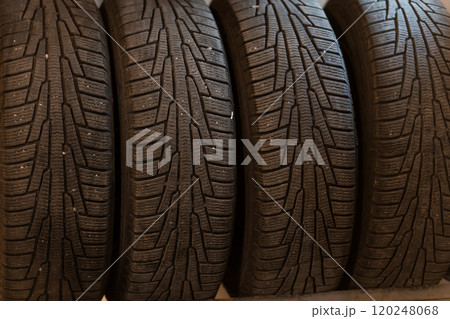 Close-Up of Four High-Performance Tires with Detailed Tread Patterns 120248068