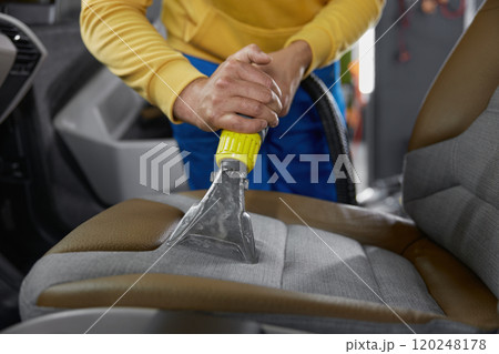 Cleaning car interior with washing vacuum cleaner Cleaning car interior with washing vacuum cleaner 120248178