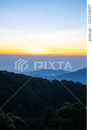 The beautiful sunrise at Doi intanon national park, Chiang Mai in the morning.Sun is rising from the hill to shy with beautiful yellow orange light. The beautiful sunrise at Doi intanon national park, Chiang Mai in the morning.Sun is rising from the hill to shy with beautiful yellow orange light. 120249607