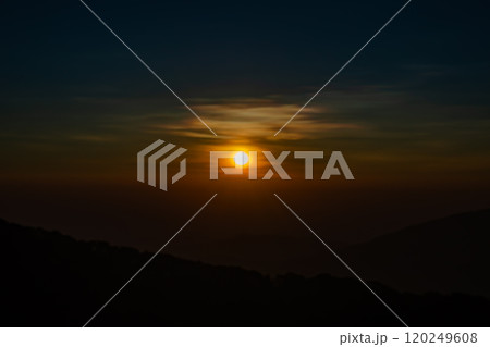 The beautiful sunrise at Doi intanon national park, Chiang Mai in the morning.Sun is rising from the hill to shy with beautiful yellow orange light. 120249608