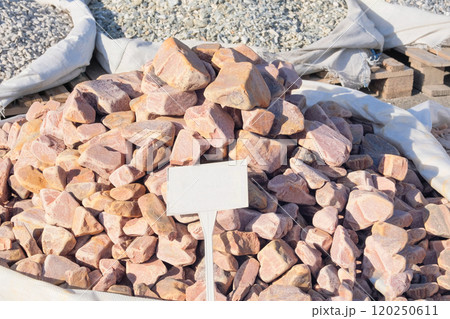 Quartzite decorative tiles are sold in construction market. Natural stone material for decoration and construction. Materials pebbles. Place for text. 120250611