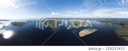 Aerial top view to island Kilpola overgrown with sparse trees in summer sunny day. Skerries Ladoga lake consisting of 650 rocky islands and steep cliffs. National park, Karelia, Russian nature. 120251413