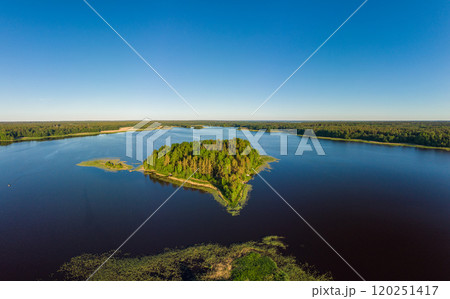 Aerial top view to island in summer evening during white nights. Vuoksa lake river and channels system leaking in Finland and Russia flowing into Ladoga. Romashki village, Leningrad region, karelia. Aerial top view to island in summer evening during white nights. Vuoksa lake river and channels system leaking in Finland and Russia flowing into Ladoga. Romashki village, Leningrad region, karelia. 120251417