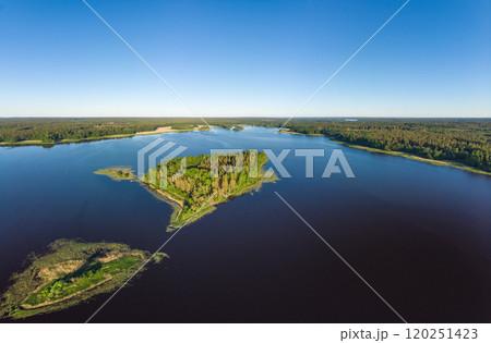 Aerial top view to island in summer evening during white nights. Vuoksa lake river and channels system leaking in Finland and Russia flowing into Ladoga. Romashki village, Leningrad region, karelia. 120251423