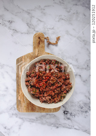 raw minced meat, marinated with spices and herbs, in a bowl, minced meat with spices, top view, homemade, no people, raw minced meat, marinated with spices and herbs, in a bowl, minced meat with spices, top view, homemade, no people, 120251912