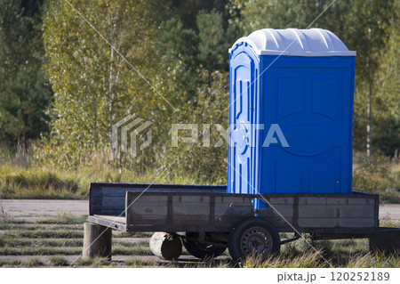 Mobile toilet. Temporary cabin toilet on a trailer in the woods 120252189
