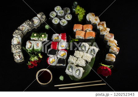 Seth sushi on a black background.Menu of the Japanese restaurant. Several sushi close-ups.A view of the rolls from above. A view of the rolls from above. Traditional Asian Food Seth sushi on a black background.Menu of the Japanese restaurant. Several sushi close-ups.A view of the rolls from above. A view of the rolls from above. Traditional Asian Food 120252343